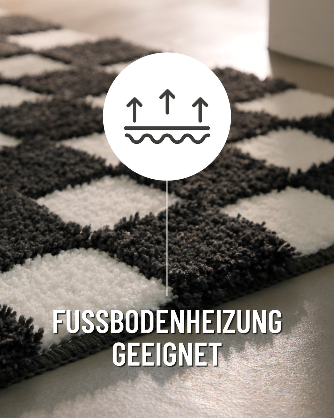 Badteppich Bobbi Anthrazit Grau Nahaufnahme der Teppichkante, Symbol zeigt Eignung für Fußbodenheizung