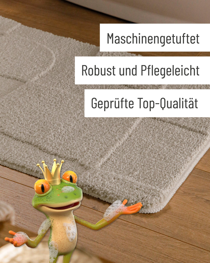 Badteppich Davie Grau Detail der Teppichkante auf Holzfußboden, eingeblendete Hinweise zu Verarbeitung und Pflege