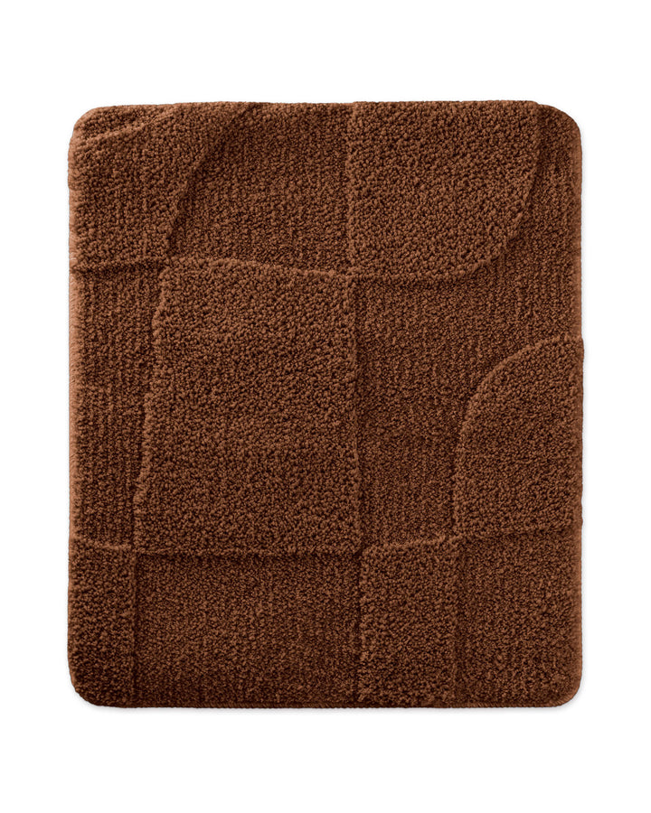 Badteppich Davie Braun rechteckig 55x65 cm, Draufsicht auf Matte mit eingeprägtem Linienmuster auf hellem Hintergrund