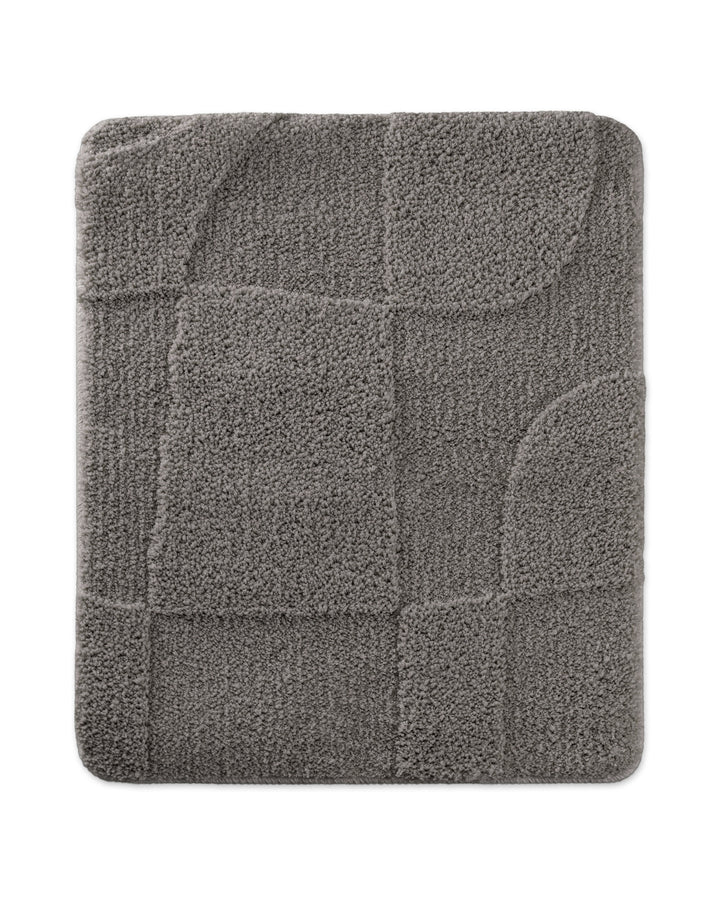 Badteppich Davie Basalt Grau rechteckig 55x65 cm, Draufsicht auf Matte mit eingeprägtem Linienmuster auf hellem Hintergrund