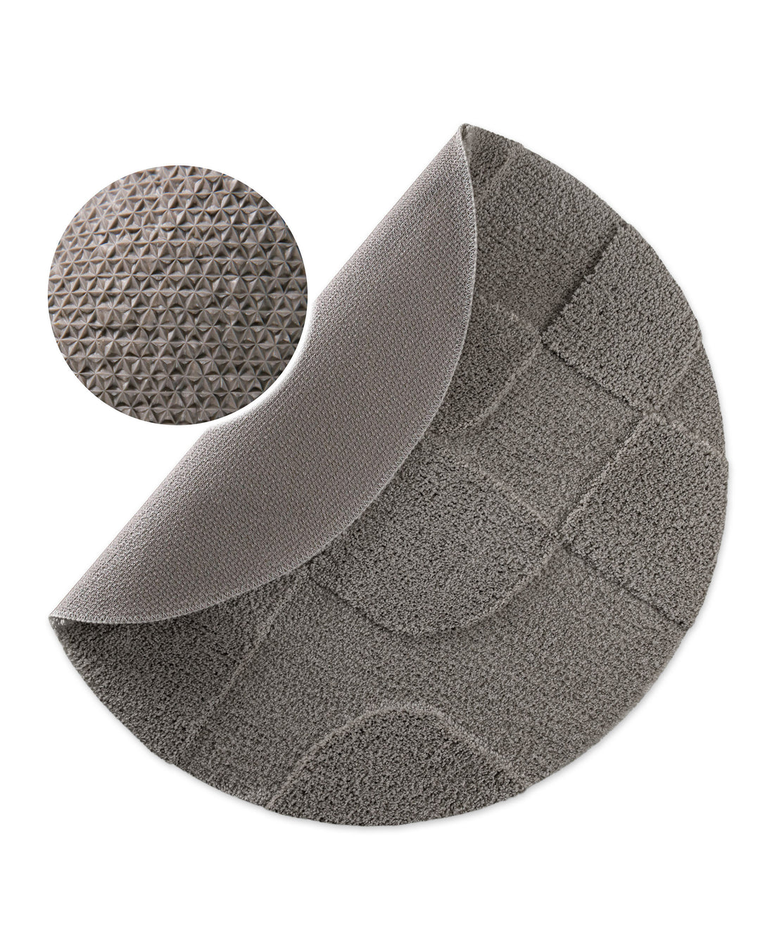 Badteppich Davie Basalt Grau rund, angehobene Ecke zeigt Basalt Graue Rückseite mit rutschhemmender Beschichtung