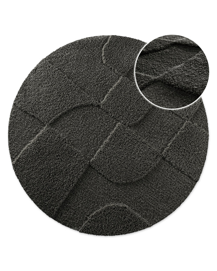 Badteppich Davie Anthrazit Grau rund, Draufsicht mit Detailkreis der Florstruktur und eingeprägtem Linienmuster auf hellem Hintergrund