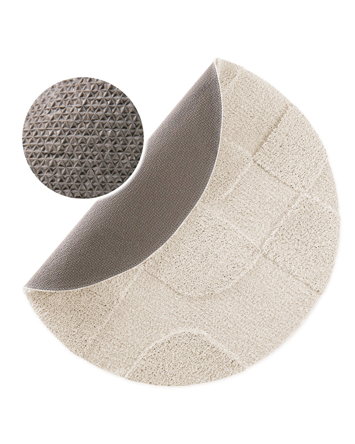 Badteppich Davie Creme Weiß rund, angehobene Ecke zeigt Creme Weiße Rückseite mit rutschhemmender Beschichtung