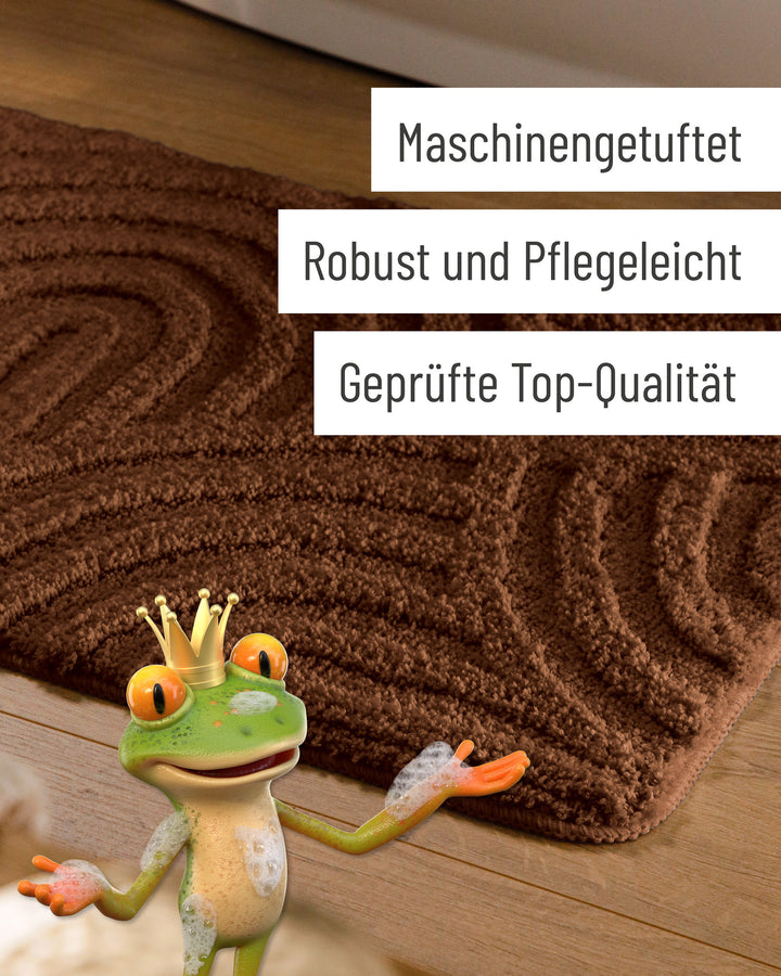 Badteppich Fiete Braun Detail der Teppichkante auf Holzfußboden, eingeblendete Hinweise zu Verarbeitung und Pflege