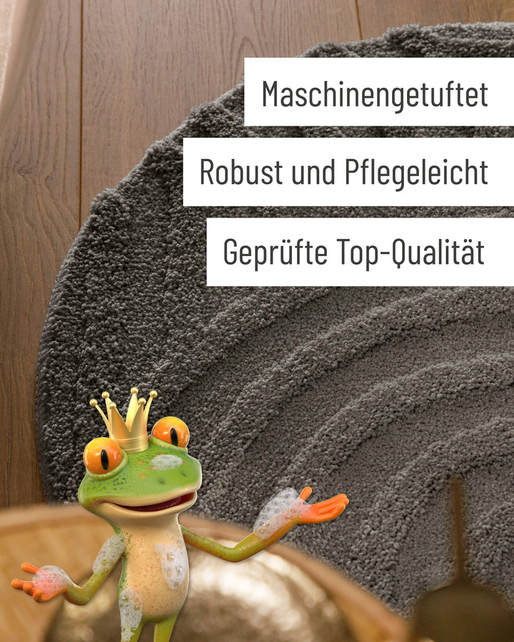 Badteppich Fiete Basalt Grau rund Detail der Teppichkante mit Hinweisen zu maschinengetufteter Verarbeitung