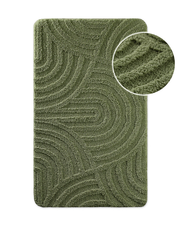 Badteppich von BathKing by WECONhome Fiete Grün, Draufsicht mit Detailkreis der Florstruktur und eingeprägtem Linienmuster auf weißem Hintergrund
