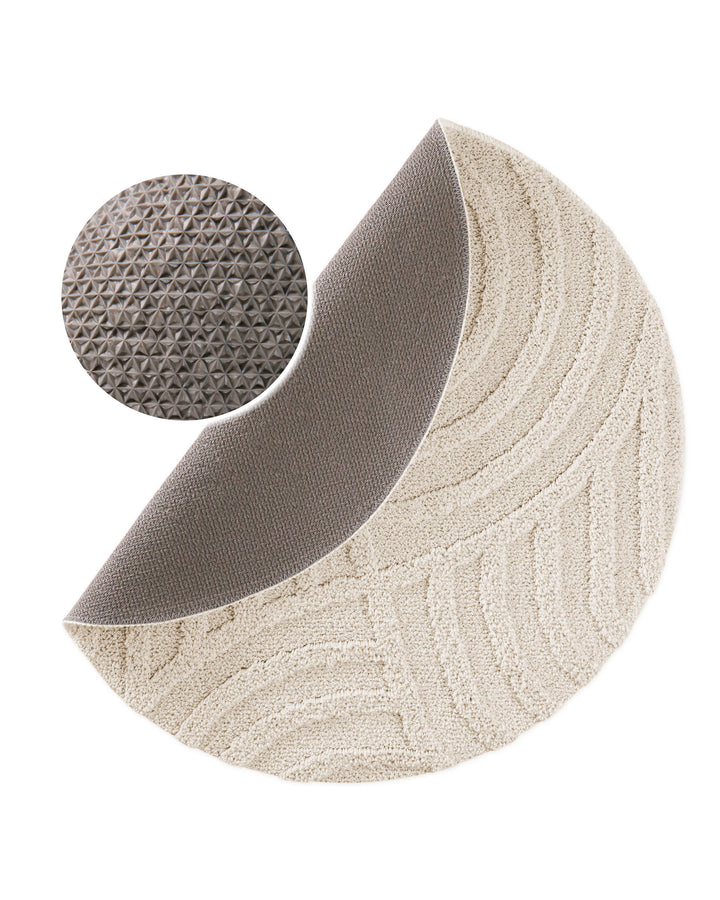 Badteppich Fiete Creme Weiß rund, angehobene Ecke zeigt Creme Weiße Rückseite mit rutschhemmender Beschichtung