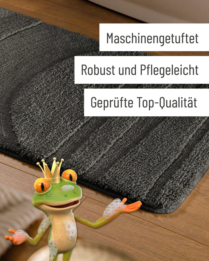 Badteppich Marc Anthrazit Grau Detail der Teppichkante auf Holzfußboden, eingeblendete Hinweise zu Verarbeitung und Pflege