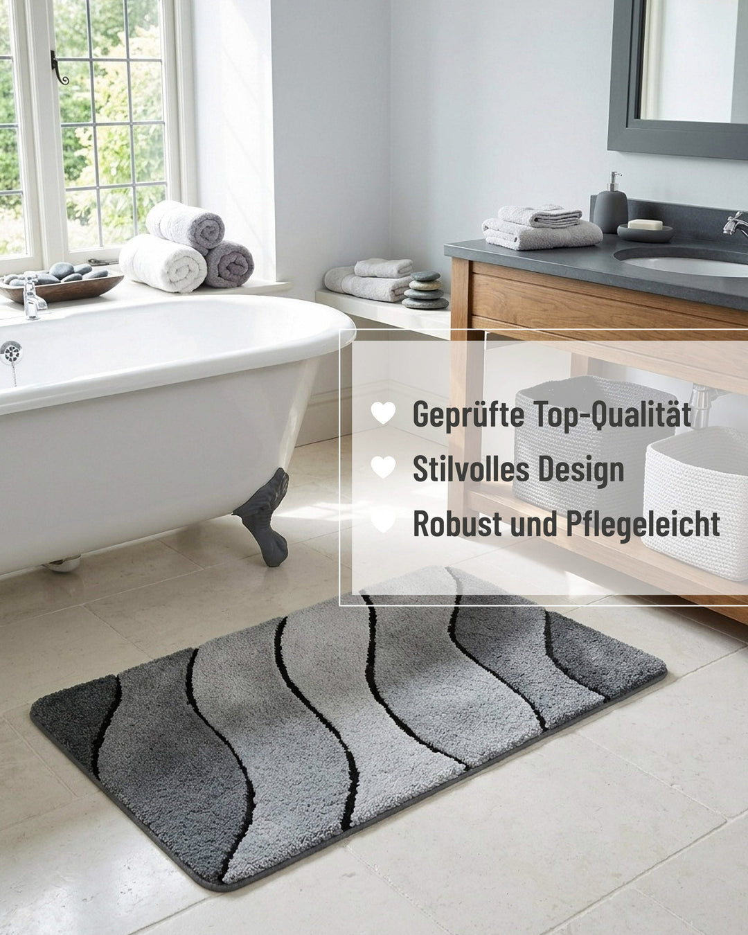 Grauer Badteppich Monte Cavo vor einer freistehenden Badewanne mit Badezimmereinrichtung, mit eingeblendeten Qualitätsversprechen: geprüfte Top-Qualität, stilvolles Design, robust und pflegeleicht