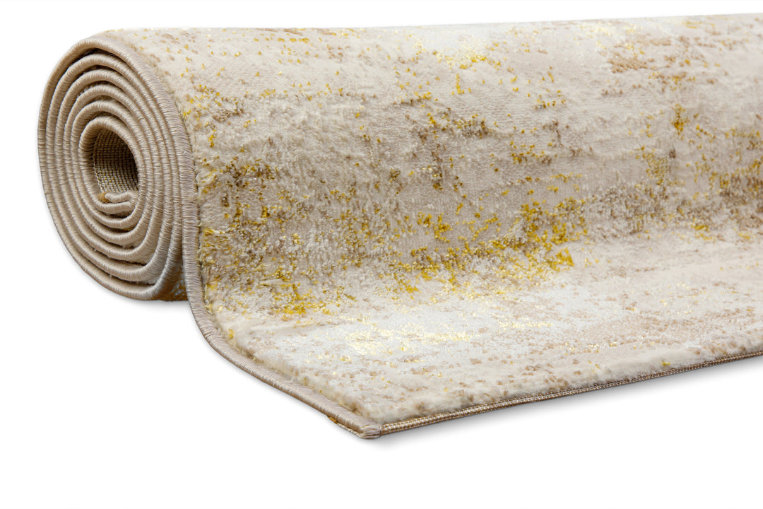 Esprit Feel Vintage 2.0 Teppich Creme Gold gerollt, zeigt Flexibilität und Materialstärke