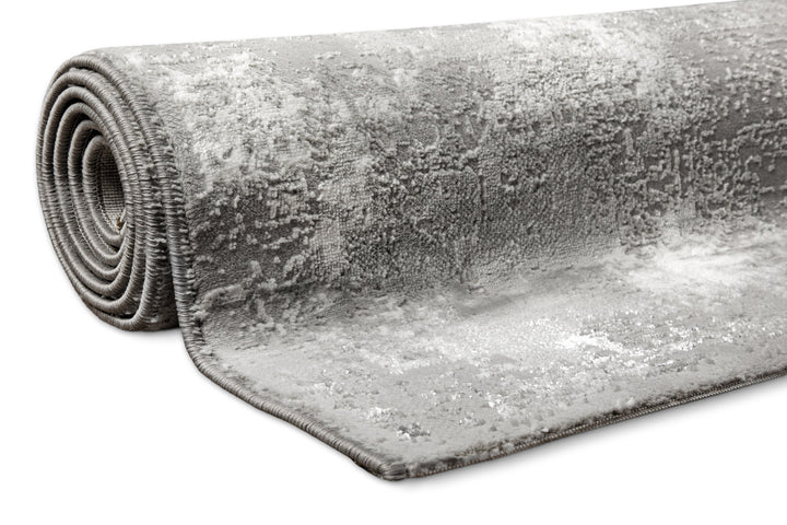 Esprit Feel Vintage 2.0 Teppich Grau Silber gerollt, zeigt Flexibilität und Materialstärke