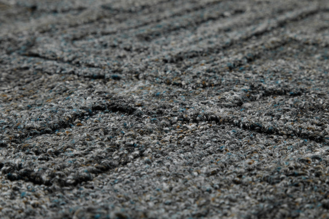 Makrodetail des Hamptons FORTYTWO Wohnteppichs mit moderner, plastischer Oberflächenwirkung.