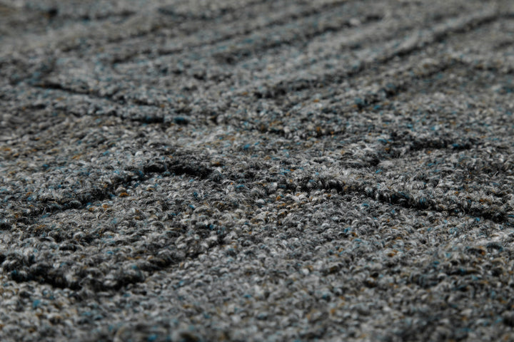 Makrodetail des Hamptons FORTYTWO Wohnteppichs mit moderner, plastischer Oberflächenwirkung.