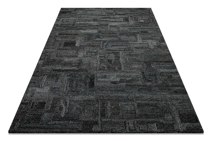 Schräg fotografierter Hamptons FORTYTWO Wohnteppich, der die besondere Oberflächenstruktur und das Design betont.