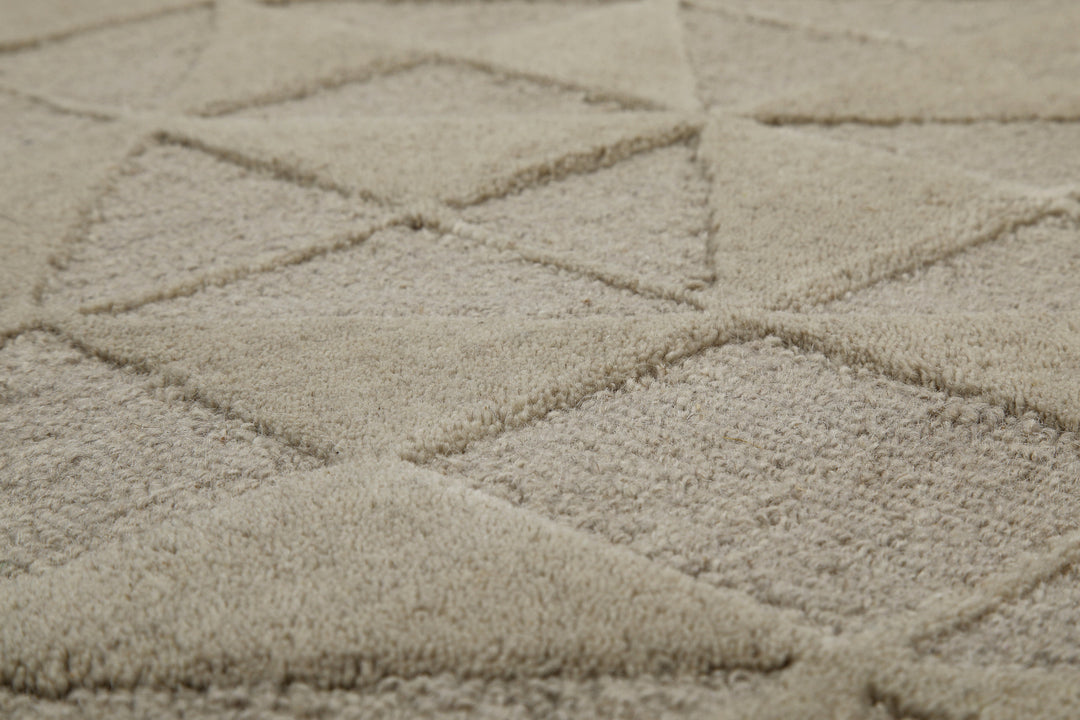 Makroaufnahme des Hamptons THIRTYSEVEN Wohnteppichs, die die hochwertige Verarbeitung und Struktur zeigt.