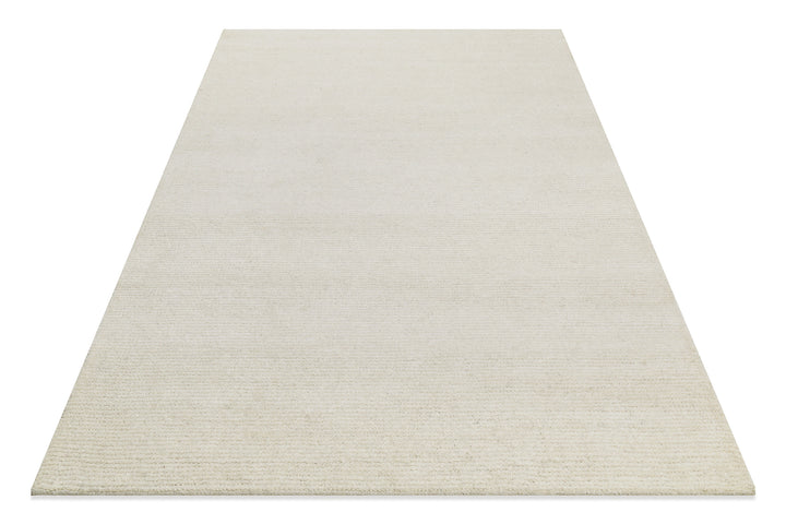 Hamptons THIRTYTWO Teppich in perspektivischer Ansicht, modernes Wohnaccessoire mit strukturierter Oberfläche und ruhigem Design.