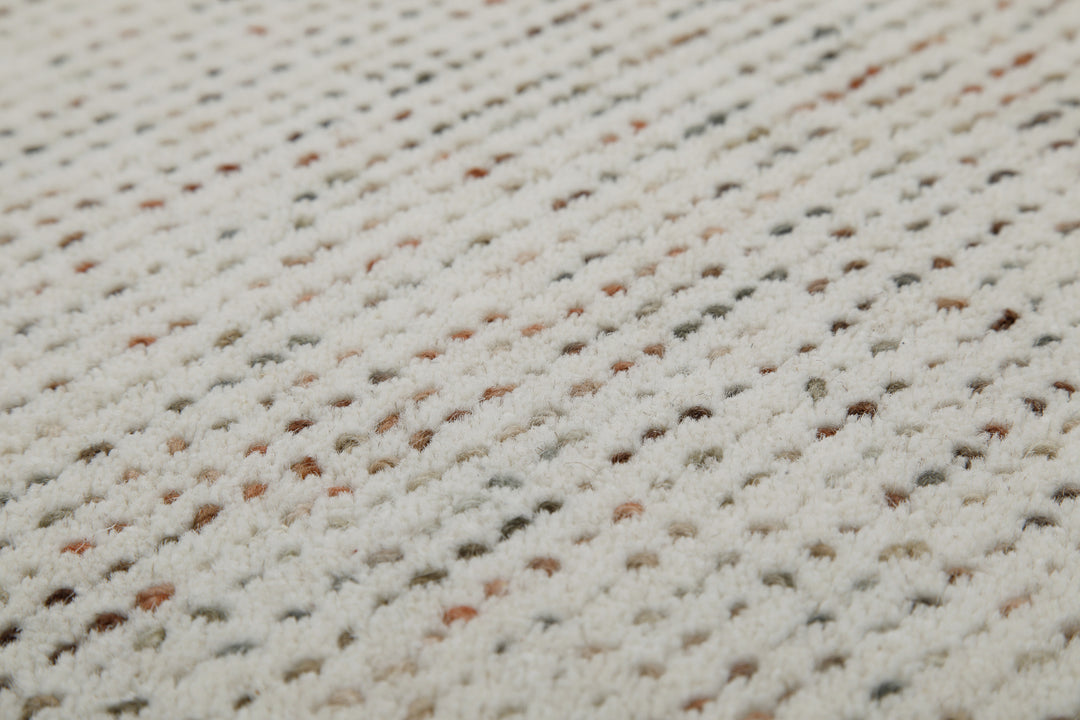 Makrodetail des Hamptons THIRTYTWO Wohnteppichs mit hochwertiger Verarbeitung und strukturierter Optik.