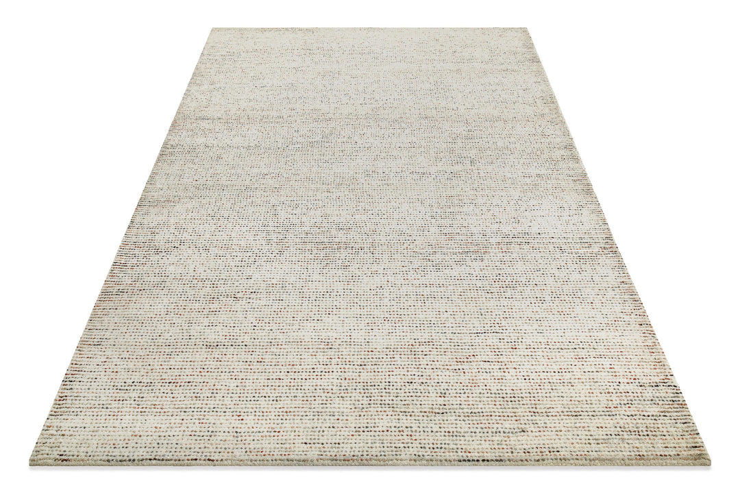 Schräg fotografierter Hamptons THIRTYTWO Wohnteppich, der die besondere Textur und das Design lebendig wirken lässt.