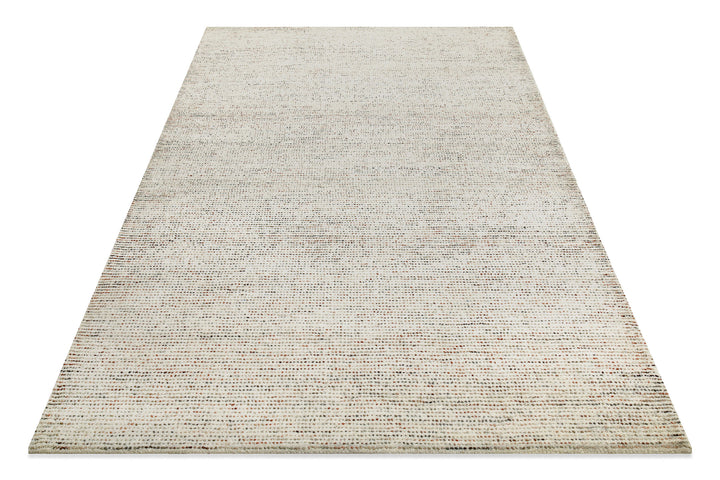 Schräg fotografierter Hamptons THIRTYTWO Wohnteppich, der die besondere Textur und das Design lebendig wirken lässt.