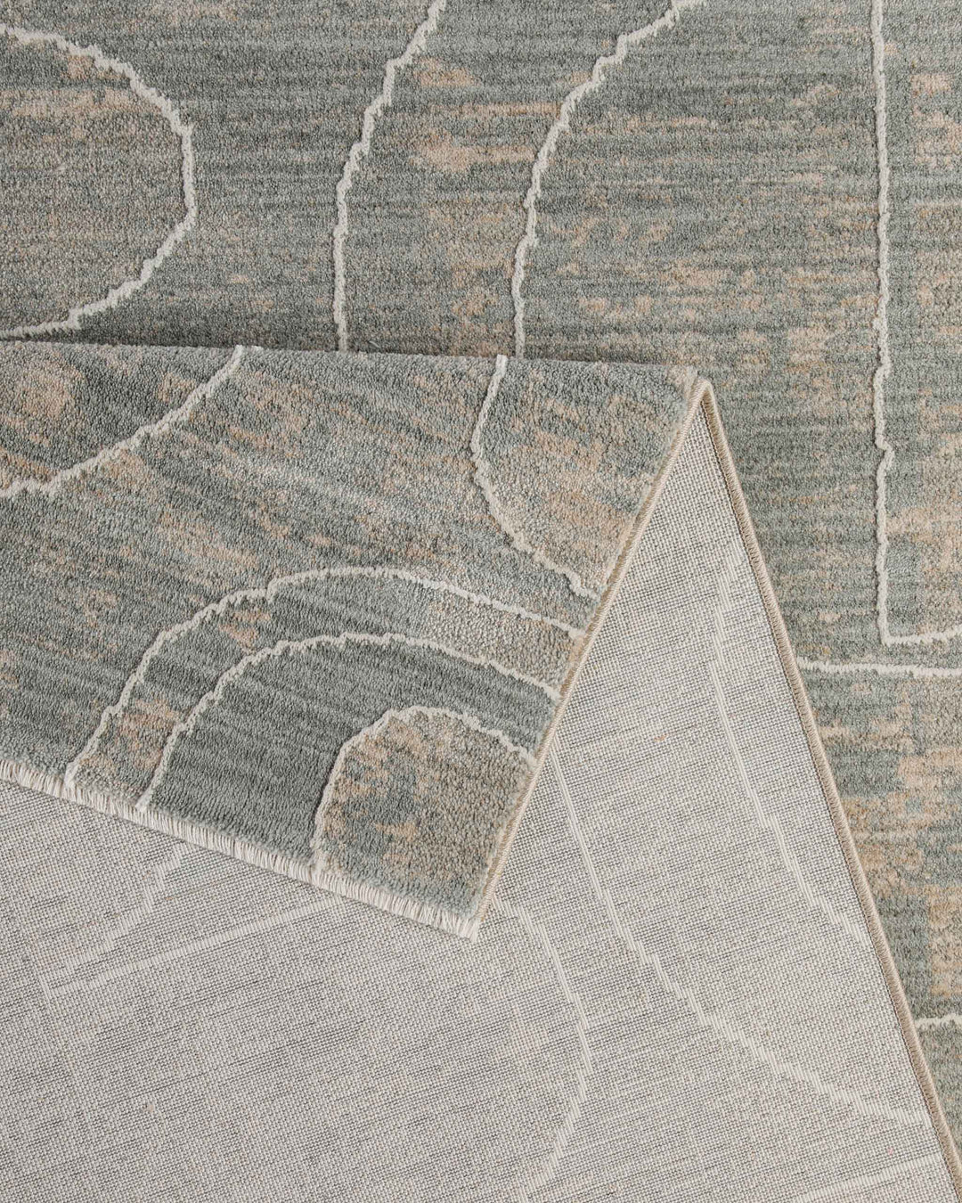 Kurzflor Teppich Beatle-B in Türkis Grau Detailaufnahme der Teppichkante und hochwertigen Verarbeitung