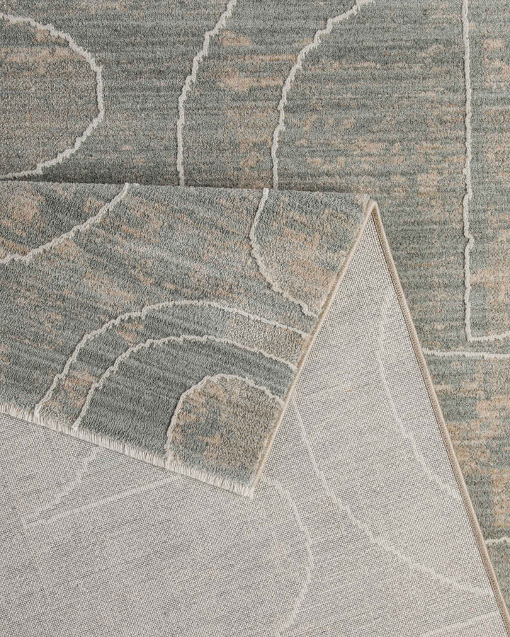 Kurzflor Teppich Beatle-B in Türkis Grau Detailaufnahme der Teppichkante und hochwertigen Verarbeitung