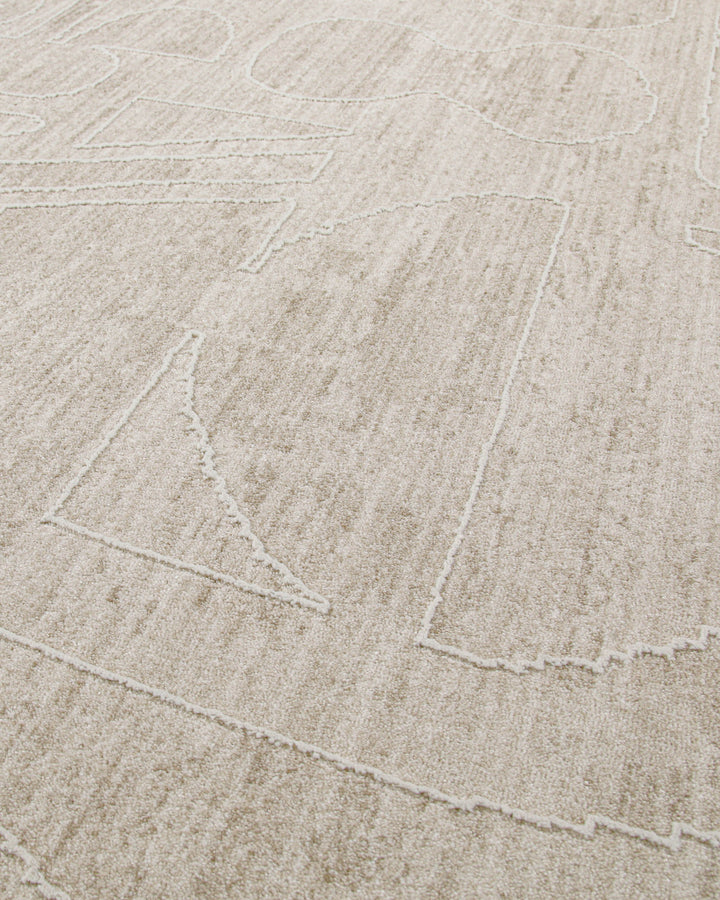 Kurzflor Teppich Beatle-B in Beige Bunt Detailaufnahme des abstrakten Musters auf strukturierter Oberfläche