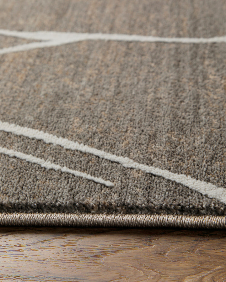 Kurzflor Teppich Elite in Beige Grau Nahaufnahme der weichen Oberflächenstruktur mit Linienmuster