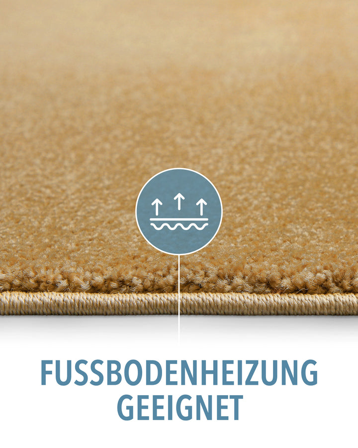 Kurzflor Teppich Montepulciano Ocker Gelb Detail mit Symbol für Fußbodenheizung geeignet