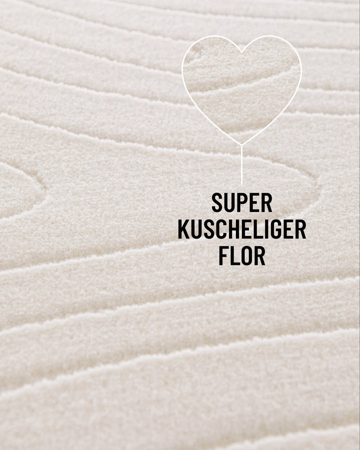Kurzflor Teppich Nuuk Flow von WECONhome Nahaufnahme mit Info: kuscheliger Flor
