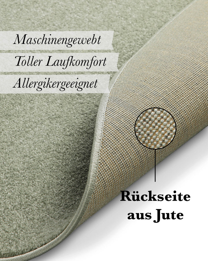 Kurzflor Teppich Freja Licht Grün rund Detail der Rückseite mit Hinweis auf Jute-Träger und Materialaufbau
