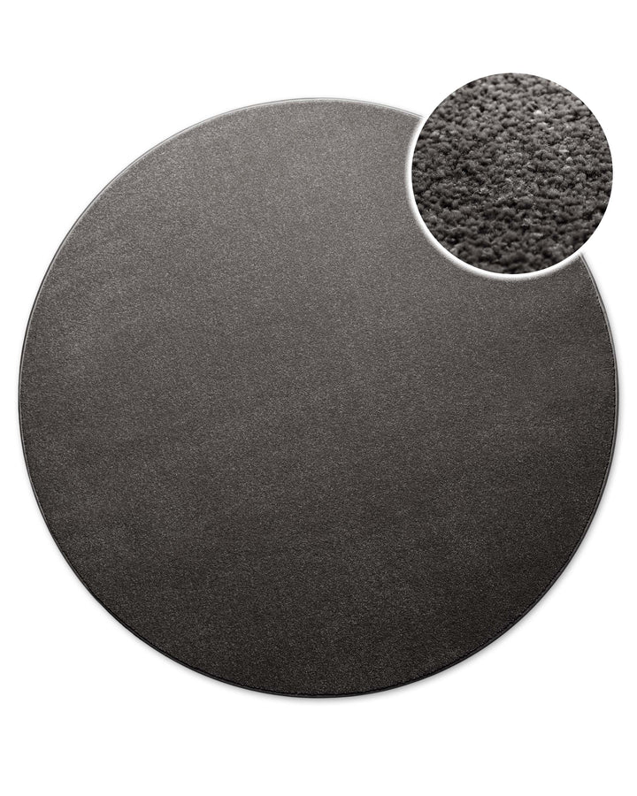 Runde Form in Anthrazit von oben gesehen, ergänzt durch einen kleinen Ausschnitt der dichten Oberfläche