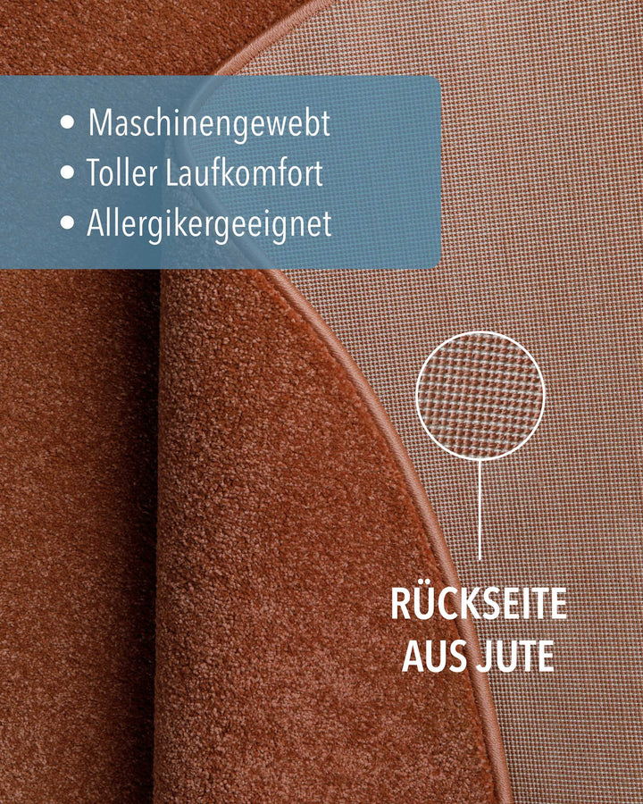 Kurzflor Teppich Montepulciano Ziegel Rot rund Detailaufnahme der Rückseite aus Jute und Materialstruktur