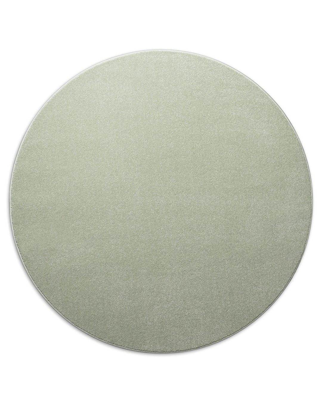 Kurzflor Teppich Montepulciano Lindgrün rund freigestellt, gleichmäßige runde Form sichtbar