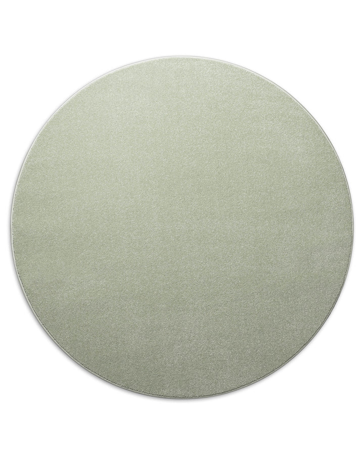 Kurzflor Teppich Montepulciano Lindgrün rund freigestellt, gleichmäßige runde Form sichtbar