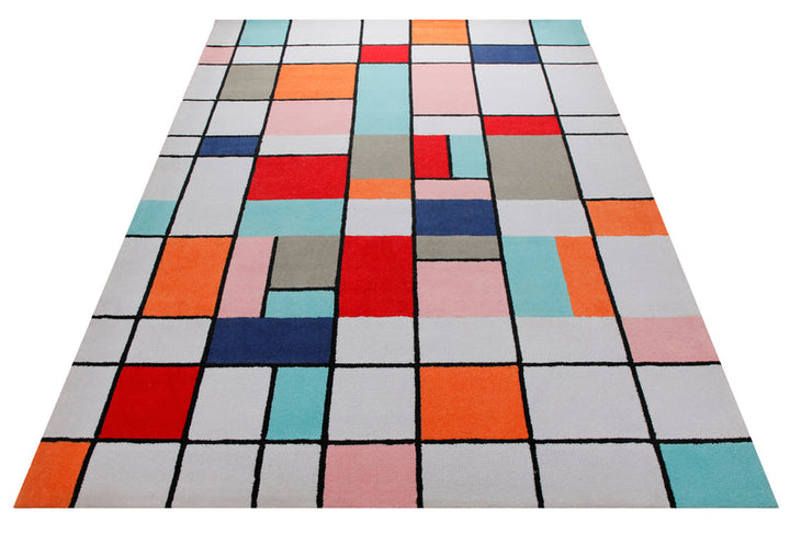 Farbraster in Rot und Türkis - Handtuft mit Gitterlinie 160 x 230 cm – Teppich im Raum platziert