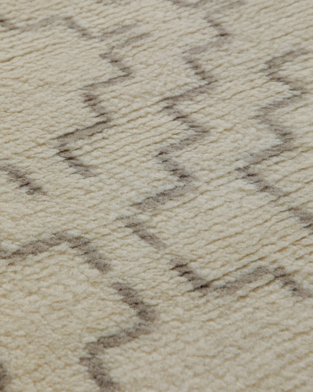 Summer Hochflor Handknüpfteppich Wolle naturweiß 160x230 cm – Close-up der Webart