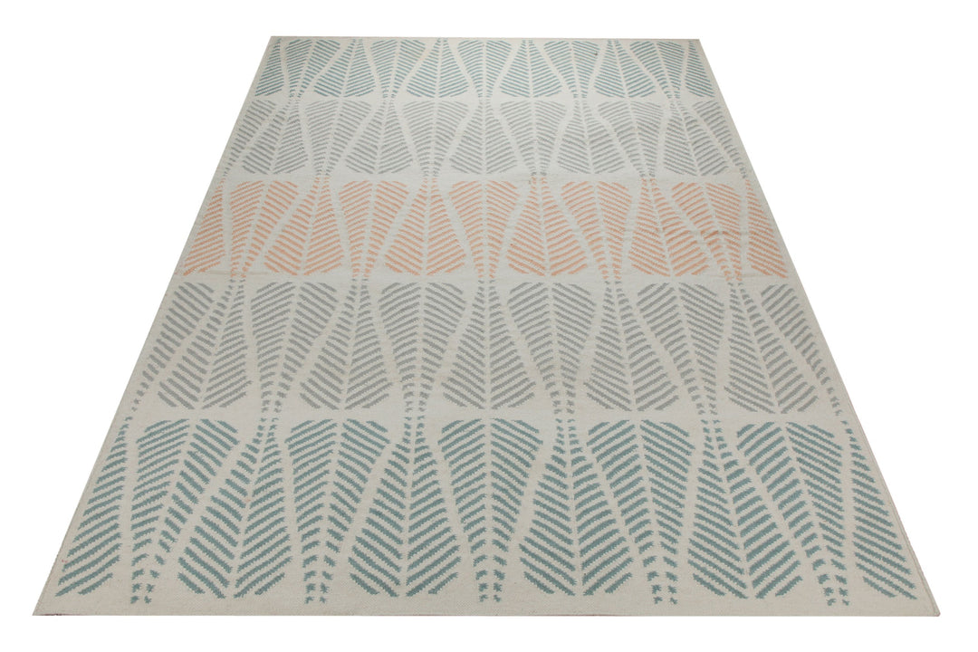 Handwebteppich Wolle Blattmuster petrol lachs 160x230 cm – Lifestyle-Aufnahme im Interieur