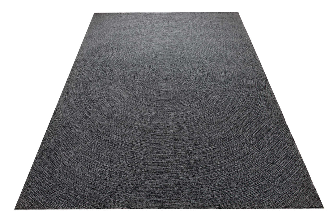 Kreiswirbel in Anthrazit - Handtuft Wolle 160 x 230 cm – Teppich im Raum platziert
